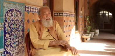Architect Kamil Khan Mumtaz at HarSukh Art residency in Pakistan, a residence he designed and built. Screenshot from Banjajaa open house documentary February 2021.