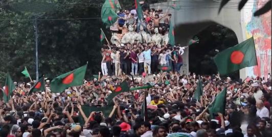 Bangladeshi citizens protest government in July 2024. Screenshot from ABC News Australia report.