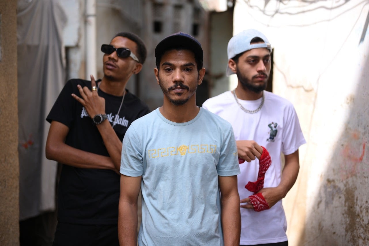 KG STANS (L-R) Rappers MC Bablay, MC Affo and MC Shobi on the streets of their Gizri neighborhood in Karachi. Photo via Saba Karim Khan / Zayer Films.