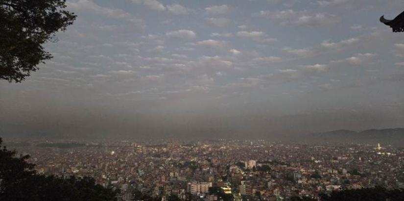 Black clouds floating over Kathmandu valley, at Swayambhu temple. Photo by Pragyan Srivastava.