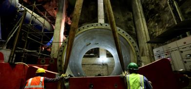 Workers install a pipe at the Upper Tamakoshi hydro project site. Courtesy of upper Tamakoshi Hydro Project