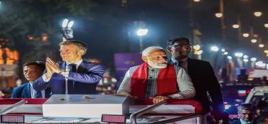 PM Narendra Modi and French President Emmanuel Macron during a roadshow in Jaipur on Thursday