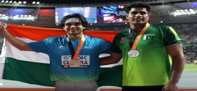 Neeraj Chopra (left) and Arshad Nadeem Neeraj Chopra (left) and Arshad Nadeem