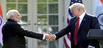 President Donald Trump and Prime Minister Narendra Modi shake hands