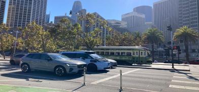 A vintage streetcar beside a driverless car on the Embarcadero, San Francisco / Photo by Surbhi Guha.