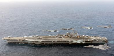 US and Indian Air Force aircraft fly in formation over the aircraft carrier, USS Ronald Reagan on Tuesday, June 23, 2021, during joint exercises off India's coast. (Photo: US Navy)