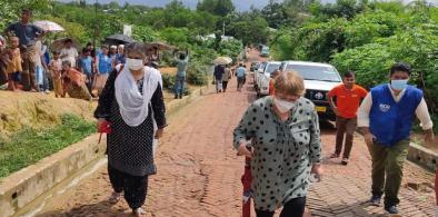 U.N. High Commissioner for Human Rights Michelle Bachelet (center) walks inside Camp 4, part of the sprawling Kutupalong camp that houses Rohingya in Ukhia, Cox’s Bazar, Bangladesh, Aug. 16, 2022 (Photo: Benar News)
