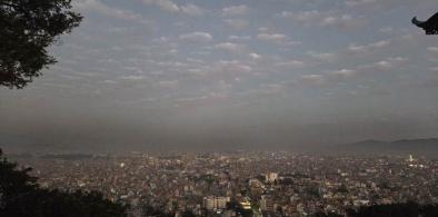 Black clouds floating over Kathmandu valley, at Swayambhu temple. Photo by Pragyan Srivastava.
